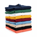 10 polo shirts neatly stacked in a variety of classic colors
